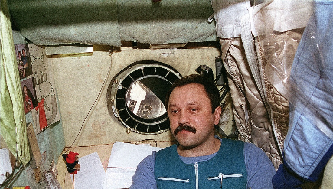 Cosmonaut Yury Usachov in his sleeping compartment on Mir called a Kayutka